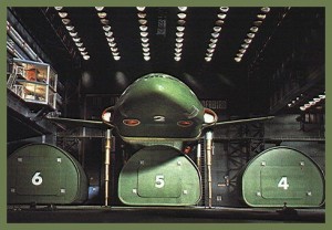 Thunderbird Two high above her various pods